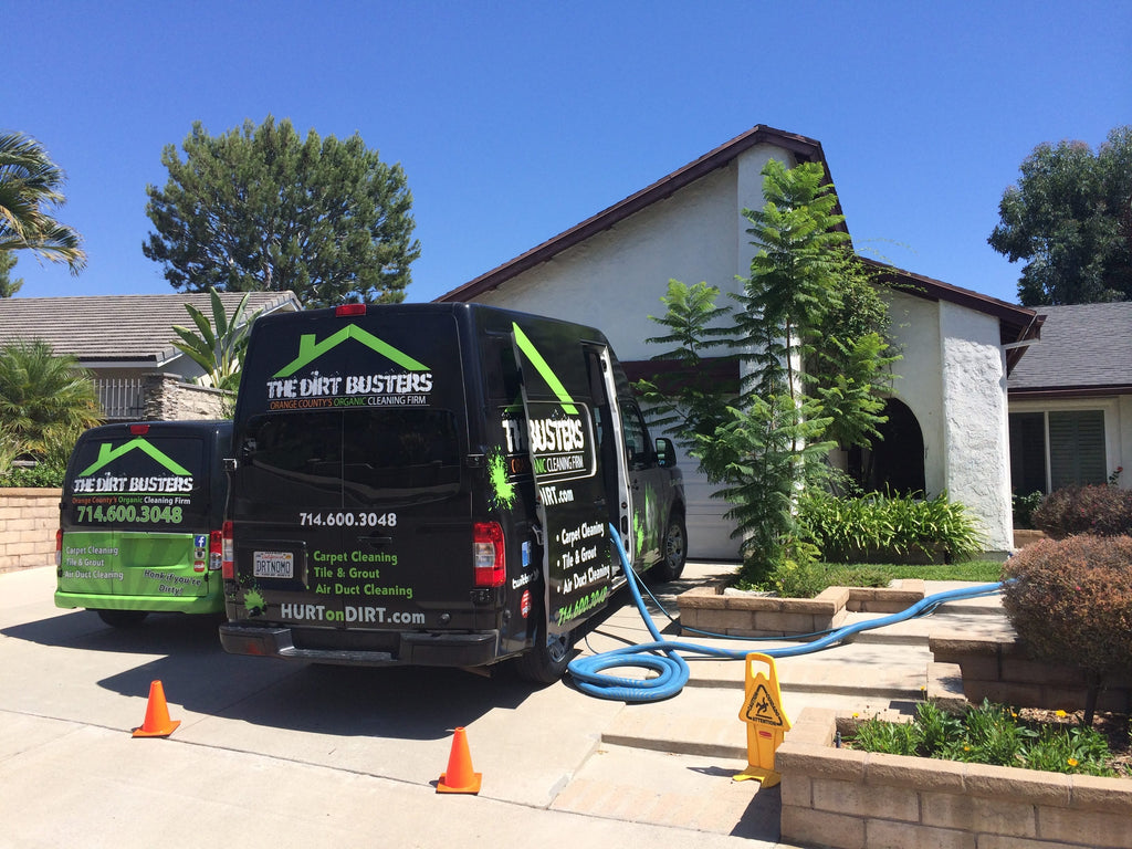 2 dirt buster vans at a customers home