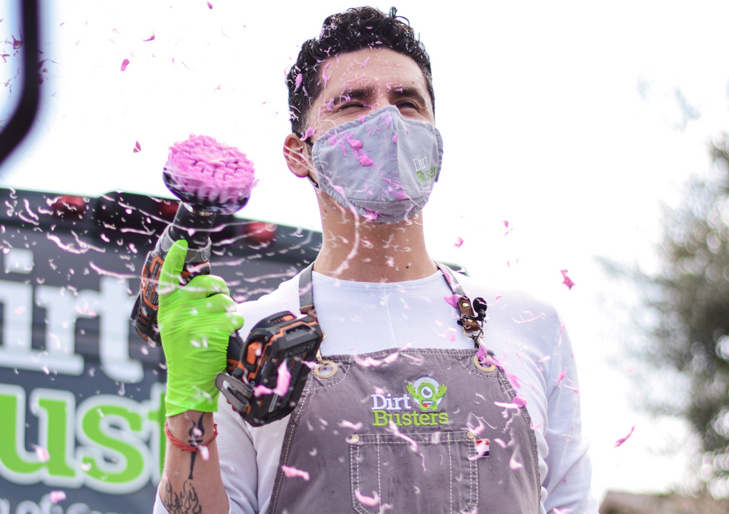 cleaning man with electric drill and pink goo